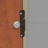 Latch Guard installed on a wooden door