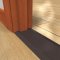 Barzen #TF8 8 inch wide threshold in dark bronze finish installed in doorway