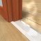 Zero 544 Threshold on Wooden Floor being used with a Wooden Door