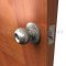 Deltana CL101EAC Entry Round Door Knob applied on wooden door