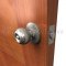 Deltana CL100EAC Entry Round Door Knob applied on wooden door