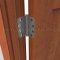 Deltana DTDSB4R5-R, Plain Bearing, Residential Grade, Brass Hinge on a Wooden Door