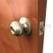 Hager 3400 Apollo Knob in US3 Finish Applied to Wooden Door
