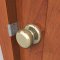 Double lipped Door Strike installed on a door with a door knob