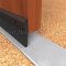 NGP 203N Door Sweep in DKB Finish surface applied to bottom of wooden door