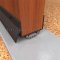 NGP 319V Door Shoe Sweep, U Shaped Aluminum Casing with Square Edges, Rain Drip, and .4375" Vinyl Finned Seal in DKB Finish applied to bottom of door