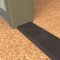 NGP 426E Utility Threshold in DKB Finish applied to floor of door entrance