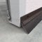 NGP D690 Door Gasket, 1.0625" Aluminum Casing with 1" Angled Nylon Brush Seal and EPDM Rubber Insert in DKB Finish applied to bottom of door