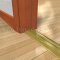 Pemko 252x2FG Bronze Mill Finish with Thermal Break on Wooden Floor