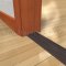 Pemko 252x2FG Dark Bronze Anodized, Thermal Break on Wooden Floor