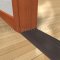 Pemko 253x4FG Aluminum Mill Finish with Thermal Break on Wooden Floor