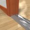 Pemko 253x4SSFG Stainless Steel Utility Threshold on Wooden Floor