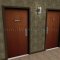 Rockwood Engraved Sign with Braille Translation-"WOMEN" in Brown Plastic Finish applied to Interior Door
