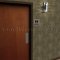 Rockwood ADA Tactile Sign with Braille, Unisex Restroom in US32D finish applied to Interior Door