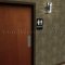 Rockwood Molded Plastic ADA Tactile Sign with Braille, Unisex Restroom in Black Plastic Finish Applied to Interior Door