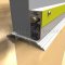 Close Up of Automatic Door Bottom with Photoluminescent Strip Applied to Metal Door
