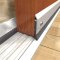 Door Bottom, Aluminum Casing with .5" Neoprene Seal on a Metal Track