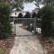 Locinox TIGER Gate Closer and Gate Hinge installed on villa gate