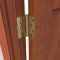 Deltana DTDSB4R4-RZ, Plain Bearing, Staggered Hole Pattern, Brass Hinge on a Wooden Door