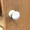 Application Image for Emtek 8030 Ice White Knob with Porcelain Rosette Polished Brass