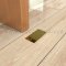 Ives Dust Proof Door Strike Installed on the Floor - US3 Finish