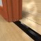 Zero 64 Black Utility Threshold on Wooden Floor